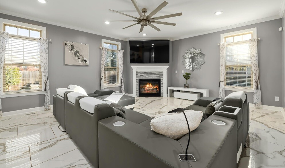 house with a fireplace inside and luxurious sofas