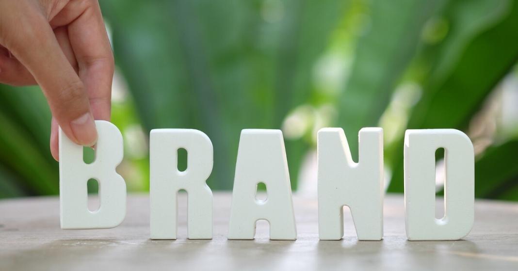 letters written as brand with green background