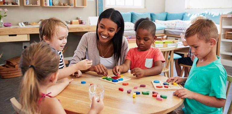 a lady and a few kids for early childhood education