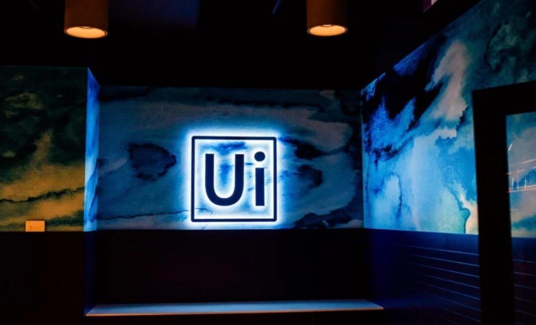 UiPath logo with bluish black background