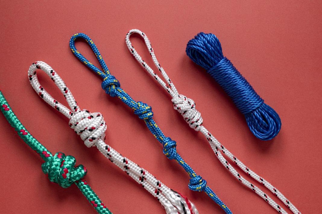 three ropes with distinct knots and a report in tied position