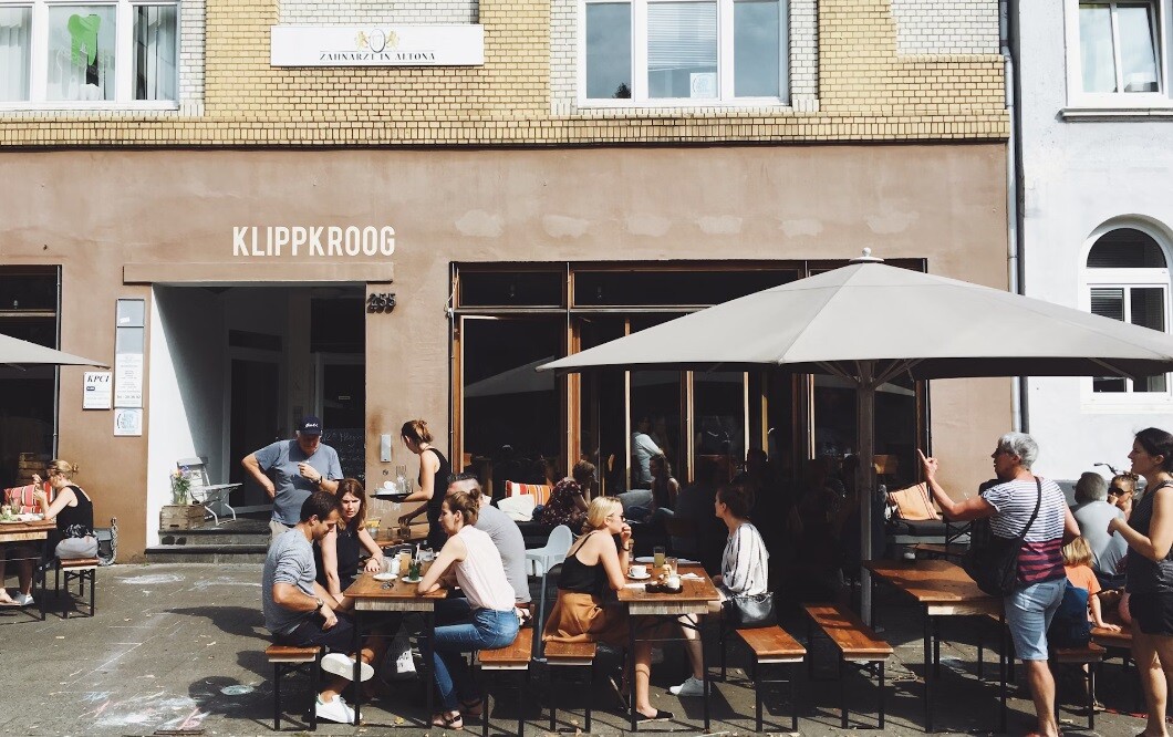 a restaurant with an umbrella to protect the customers from sunlight and rain