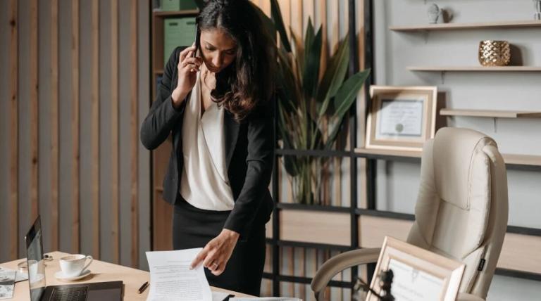 a lawyer checking the documents and talking over a phone