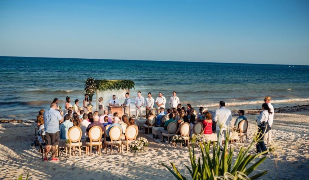 a beautiful sea, sky and a setup of wedding ceremony