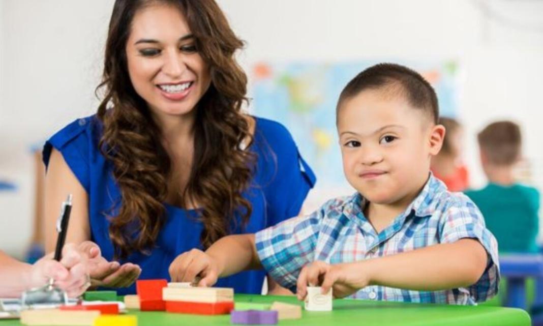 a mother and child doing an activity on a table showing child health