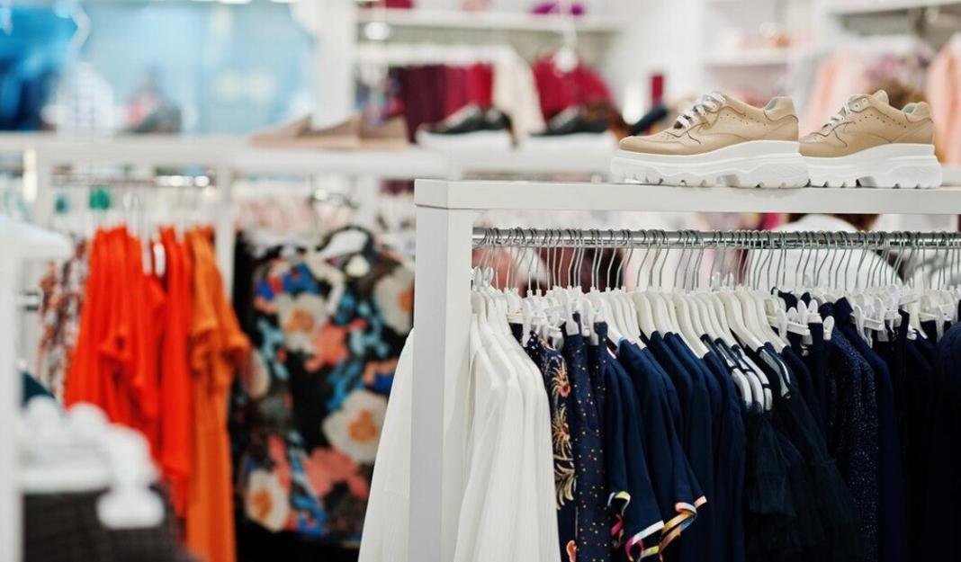 a collection of dresses in a store depicting the retail business outlet