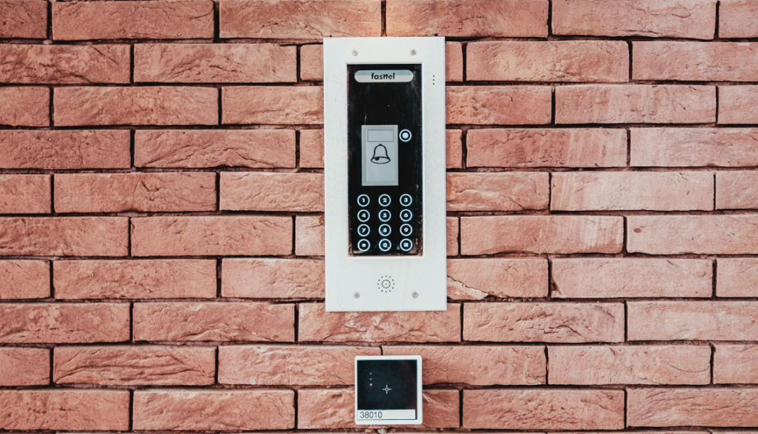 a intercom device placed in front of the door wall for communication with the residents