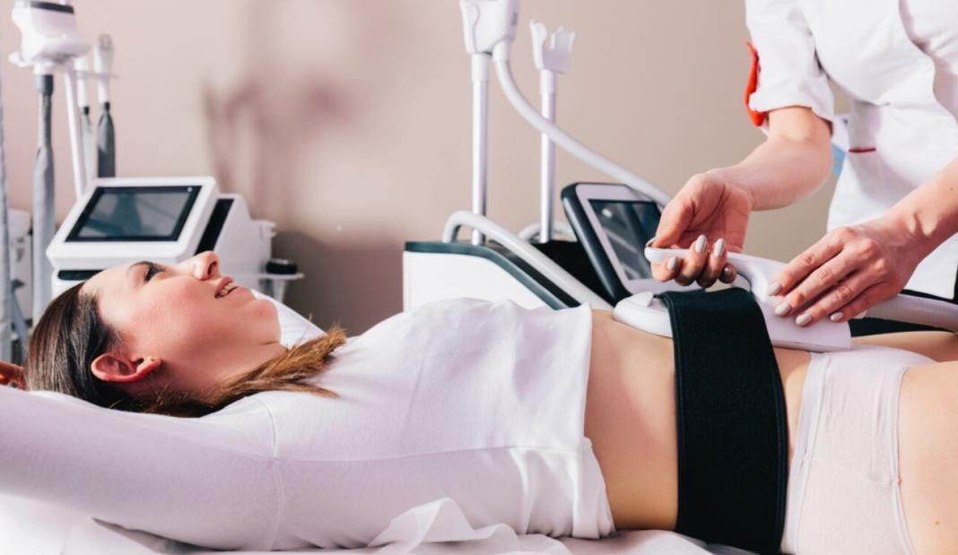 a lady undergoing a Cryolipolysis treatment in a medical centre