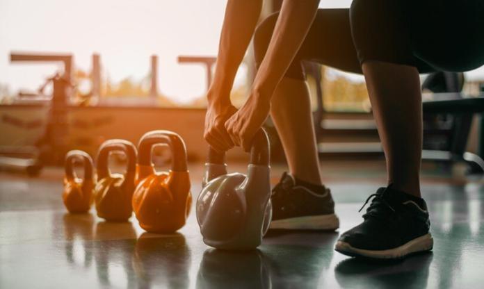 a person taking lifts as part of physical training