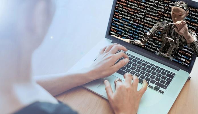 a lady programming on a laptop using her hands with coding on the screen