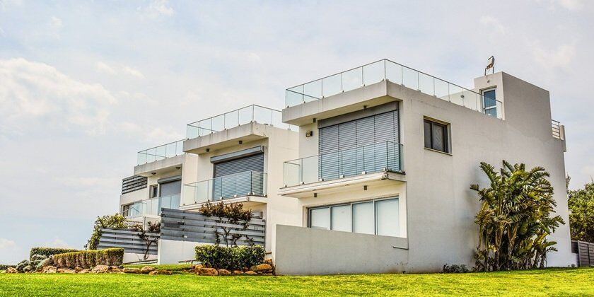 dual occupancy house in a series of houses with lawn and clear sky