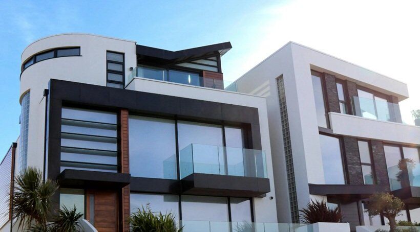 strong building house in brown and white color with clear blue sky