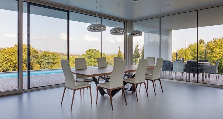 a dinning table with concreate floor coatings in modern style