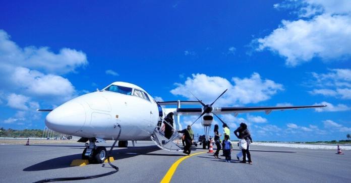 airplane jet lands on the ground and a few passengers get down from it