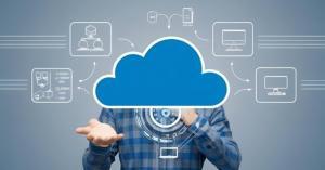 a man behind a cloud symbol showing the cloud technology