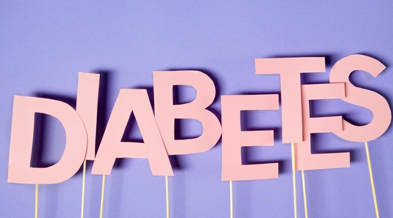 diabetes word written in pink color on a blue background