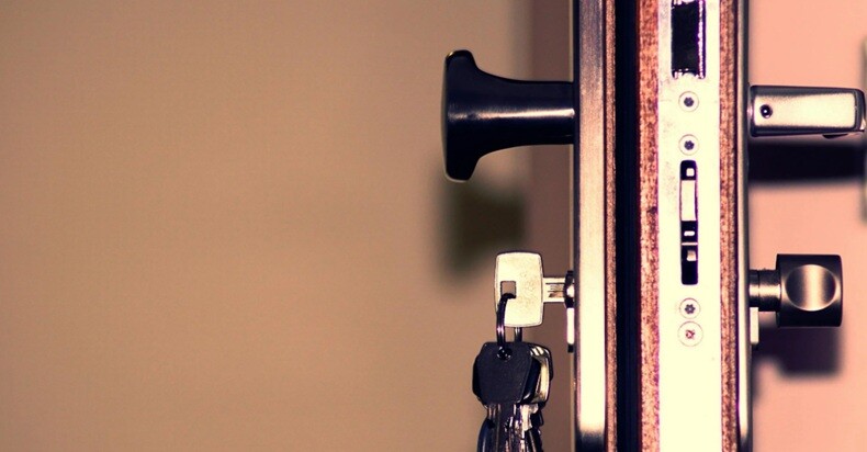 cross section of a door lock with a key placed in the lock