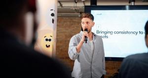 a person talking to audience on employee training with a screen display