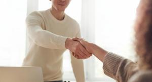 a person giving handshake to a lady as part of the interview process