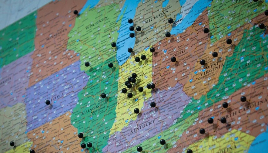 a map showing different states and black pins on most of the states