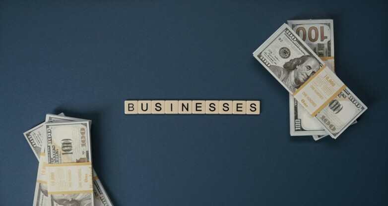 US dollar currency seen with the letter businesses written in the center
