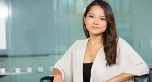 an office lady in white shirt looking confident as part of her career