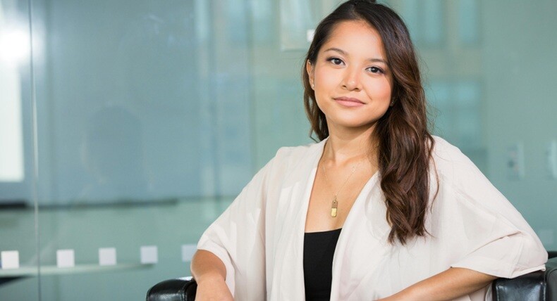 an office lady in white shirt looking confident as part of her career