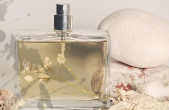 costly scent shining liquid placed on a table