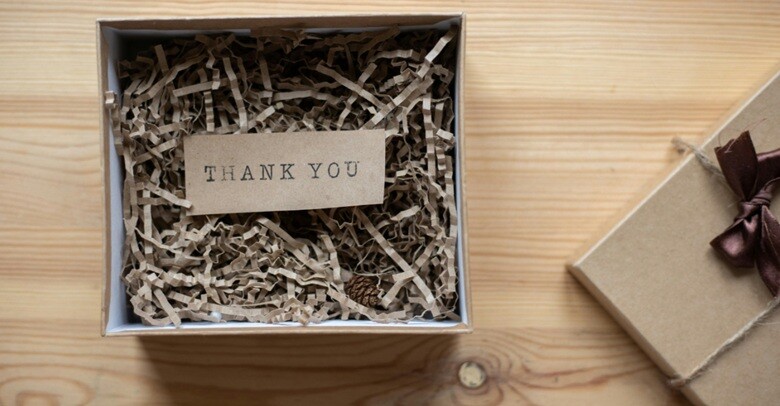 appreciation gift box with a thank you note placed on a table