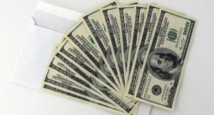 US currency notes displayed in order on a table