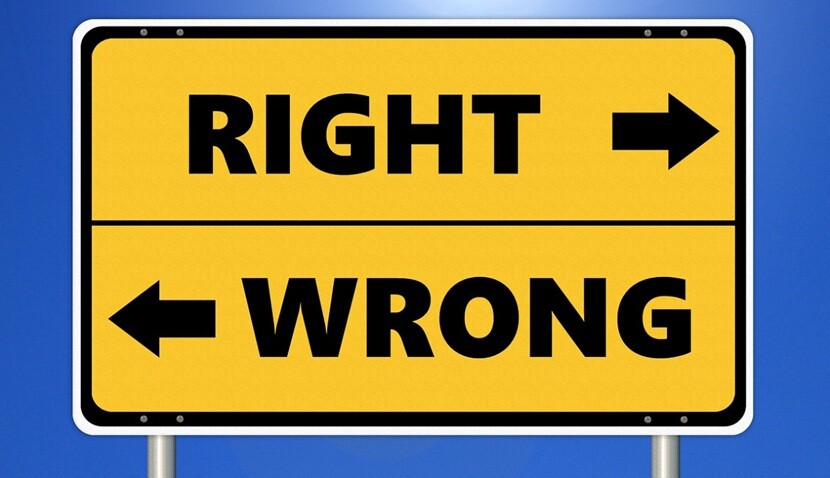 right and wrong written on a sign board on opposite directions