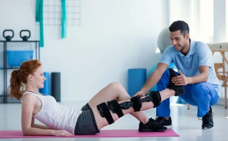 leg massage a lady leg massage done by the health expert on the floor