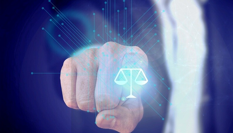 a lawyer pointer to a justice weighing symbol with a digital graphics on it