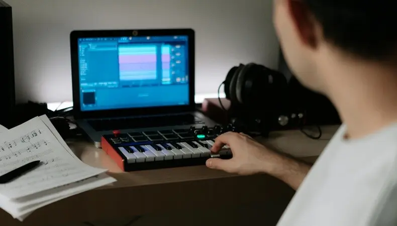 music producer a music producer working on AI with a small piano