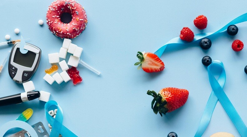 strawberry and medicine placed on a table with blue background