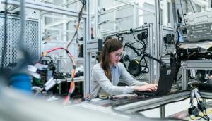a lady working with a laptop on research and development center