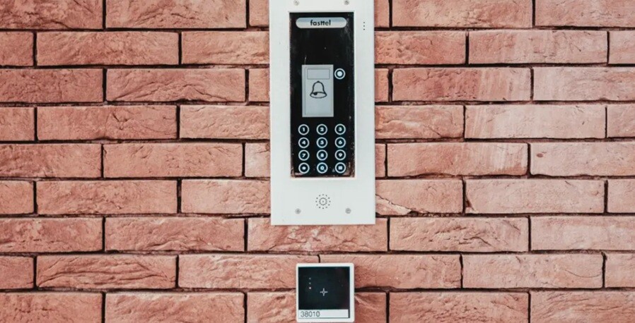a intercom device placed in front of the door wall for communication with the residents