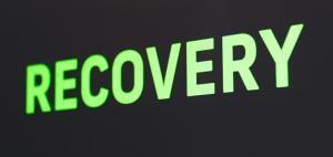 the word recovery written in green with black background