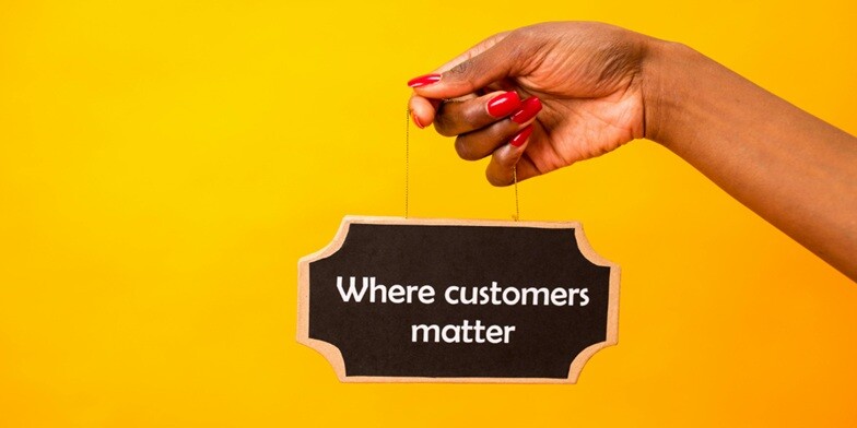 a lady holding wooden plank in which customers matter is encrypted
