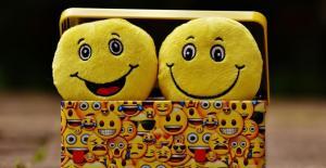 two smileys with happy faces places inside a colorful box