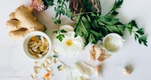 iron rich foods with iron medicines with leaves and white background