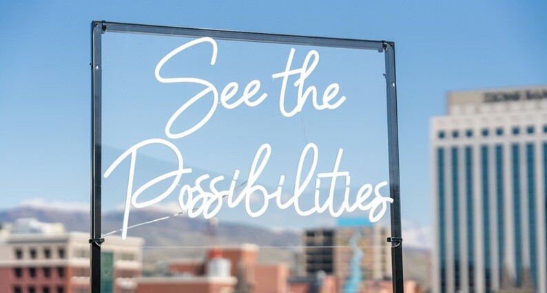 city skyline during the daytime with the phrase ‘see the possibilities