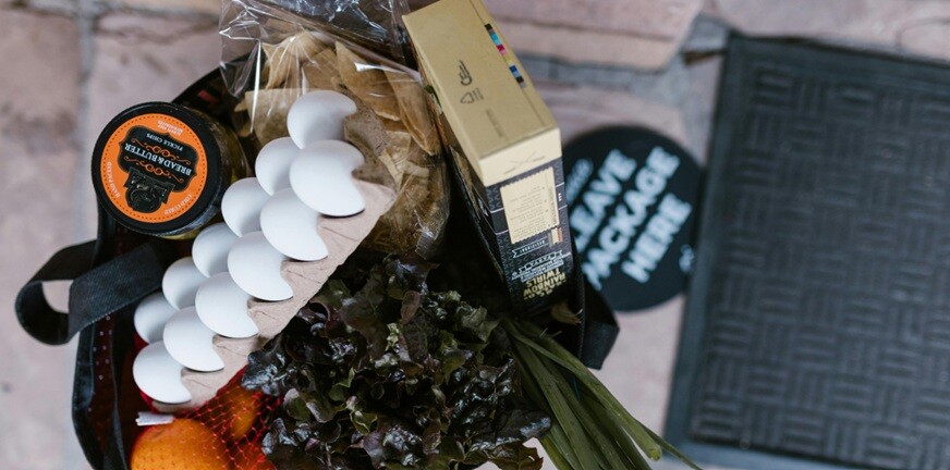 waste management food waste dumped on a plastic cover and placed in a bucket