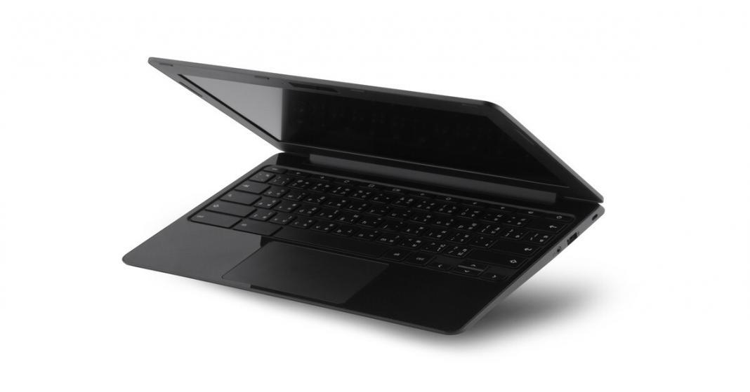 A black laptop is tilted with the screen and keyboard slightly facing downward. The laptop is slightly open.