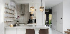 home with oven, air conditioner and other appliances are seen