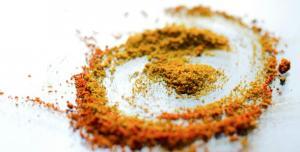 Macca powder placed on the table in powder form in brown color