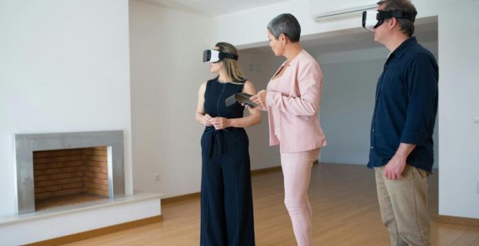 a couple using augmented reality to view the inside of a home property