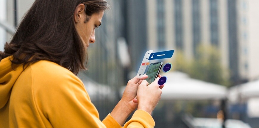 a person looking at a mobile with his two hands in an office background