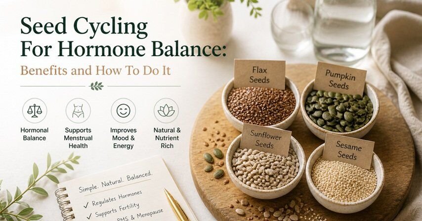 Natural wellness setup with bowls of seeds, glass water bottle, and soft greenery on a wooden surface in a calm, minimalist setting.