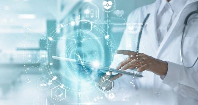 Doctor using a digital tablet with AI-powered healthcare technology, electronic health records, and virtual medical data in a modern hospital, representing the future of healthcare in 2026